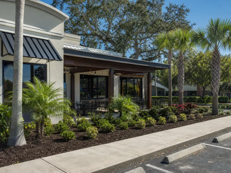 Fresh mulch beds along the front of a local restaurant in Valrico, FL